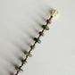 Beaded bracelet with unakite beads and a gold magnetic clasp on a light gray background