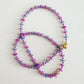 Multicolored beaded necklace on a light gray background